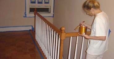 Sam topcoats the railing