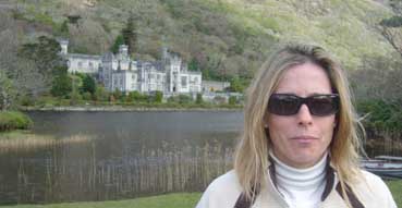 Sam smirks by the Kylemore Abbey.