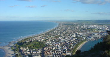 View of Mount Maunganui (the city) from atop Mount Maunganui (the hill).