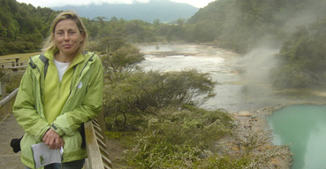 Sam next to one of the more colorful displays at Waimangu Valley.