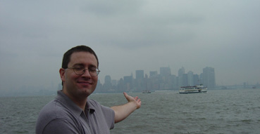Eric points out Manhattan from Liberty Island.
