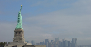 Manhattan skyline on a mostly sunny day.