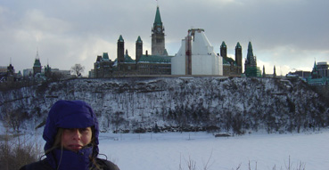 Sam shivers in front of the Capital library, currently under construction.