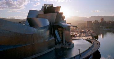 The sun sets behind the magnificent Bilbao Guggenheim.